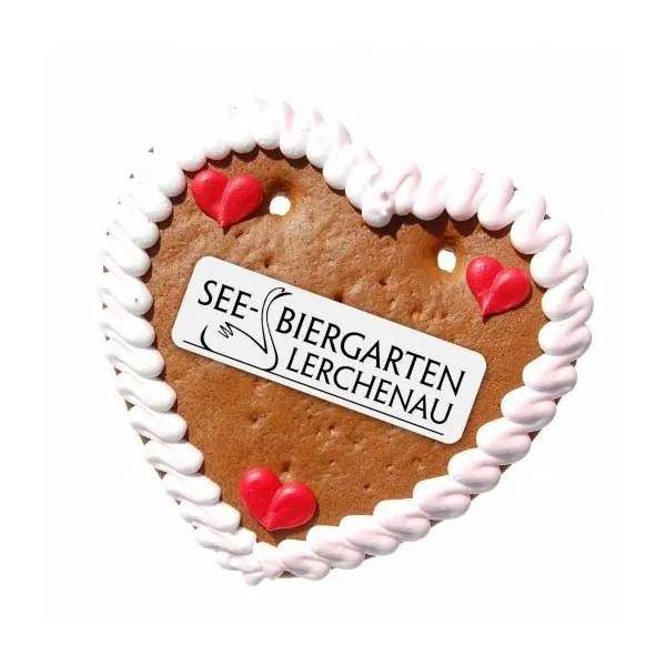 Produktbild von Lebkuchenherz Größe M mit individuellem Marzipanlogo, eingehüllt in Glanzfolie und weißem Umhängeband.