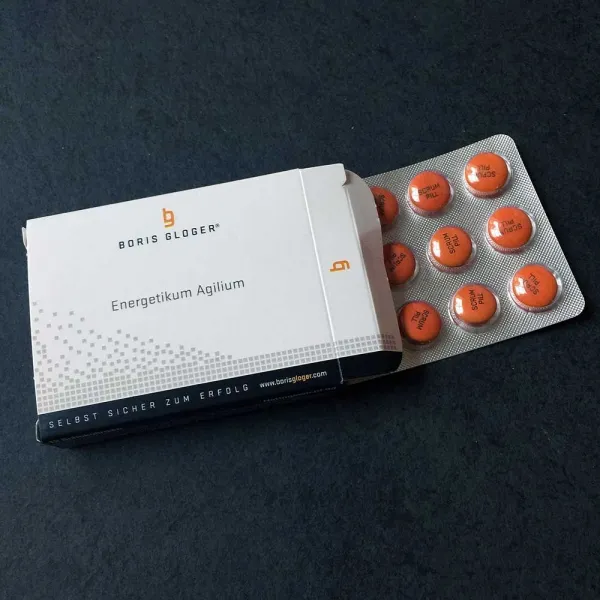 Produktbild von Schokolinsen mit individuellem Aufdruck als kostengünstige Werbeidee für Ihr Mailing, verpackt in Tabletten-Optik.